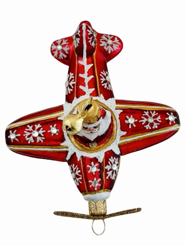 Festive Santa airplane Christmas ornament – a red and gold hand blown glass Christmas tree decoration featuring Santa Claus piloting a glittery holiday propeller plane adorned with snowflakes and snowy sparkling accents.